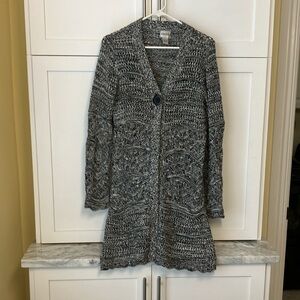 Chico’s long cardigan sweater with long sleeves and front button closure.